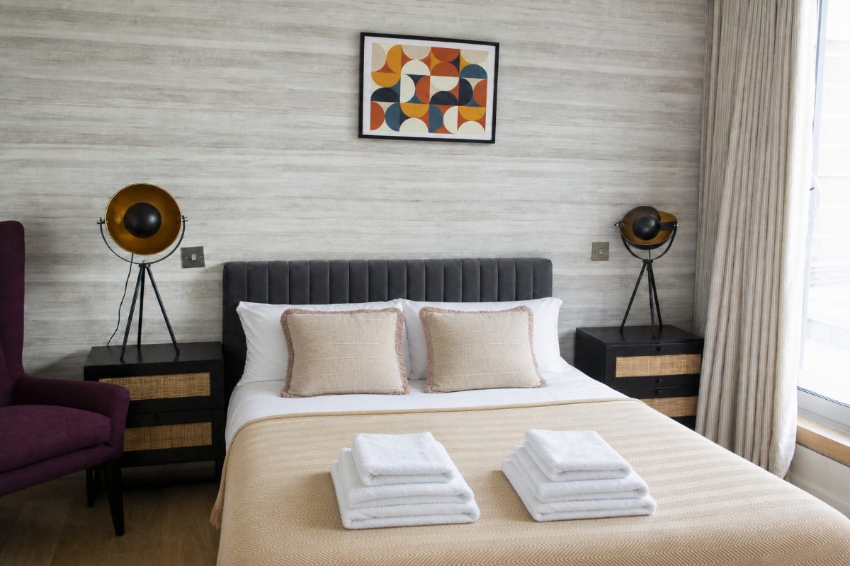 Illustrative hotel bedroom after a professional cleaning reset